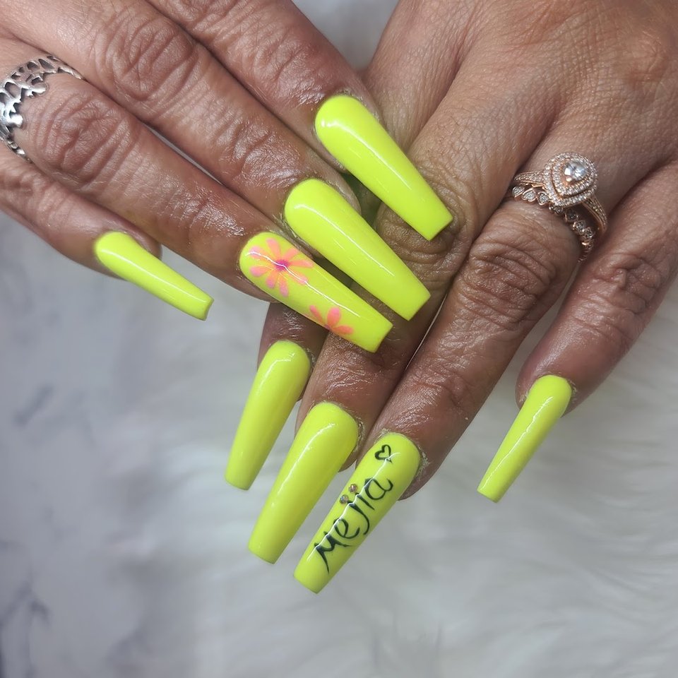 Manicured nails with glossy polish on display.